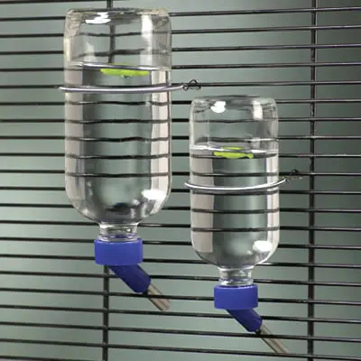 A pair of water bottles attached to a cage